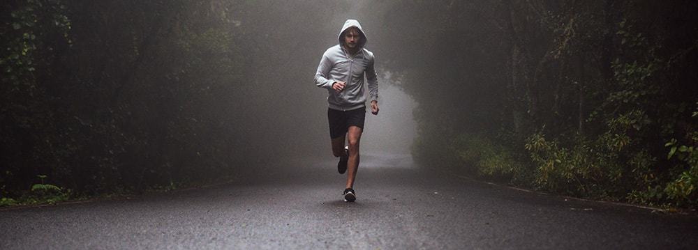 man running down road